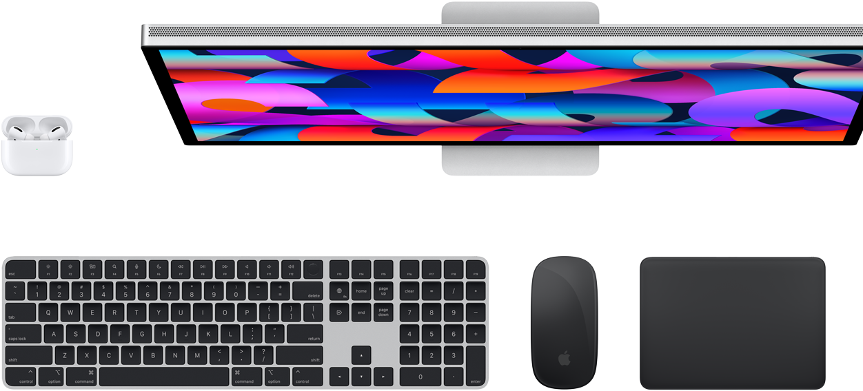 Top view of AirPods, Studio Display, Magic Keyboard, Magic Mouse and Magic Trackpad.